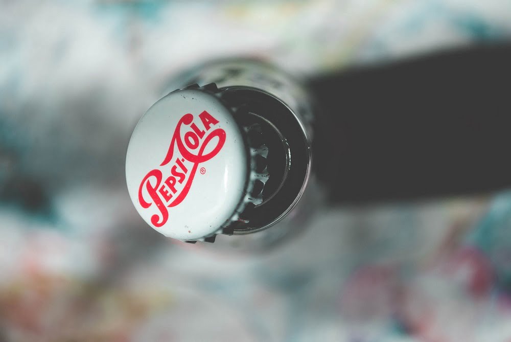 a closeup of the custom company logo on the bottle cap