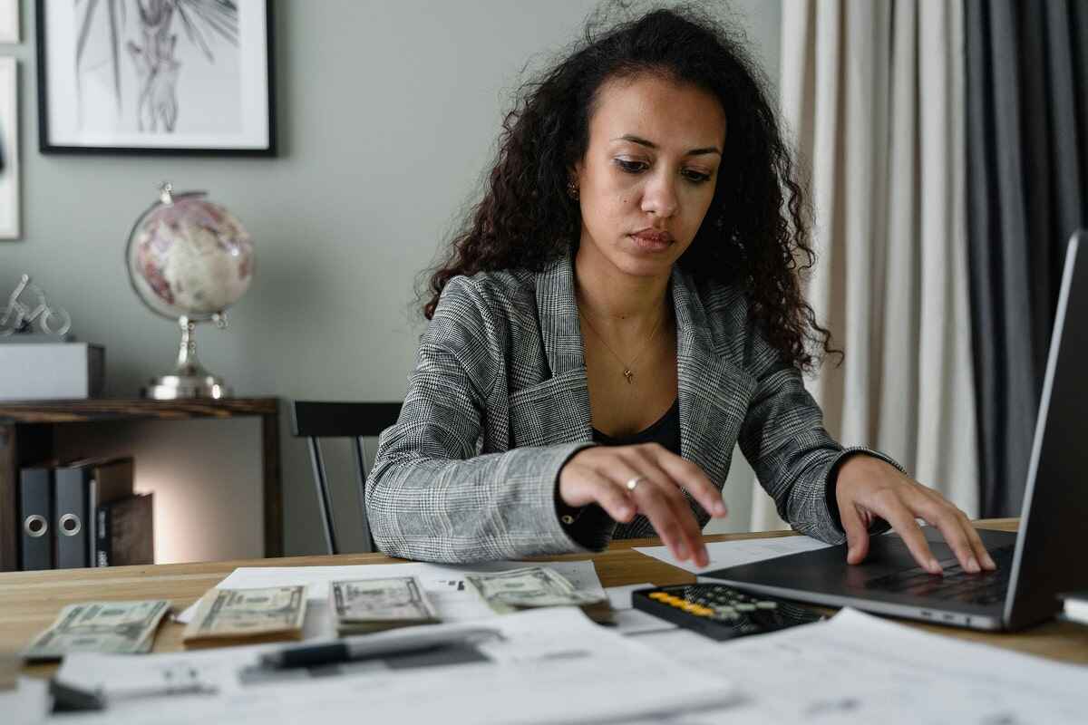 a woman working to make money passively